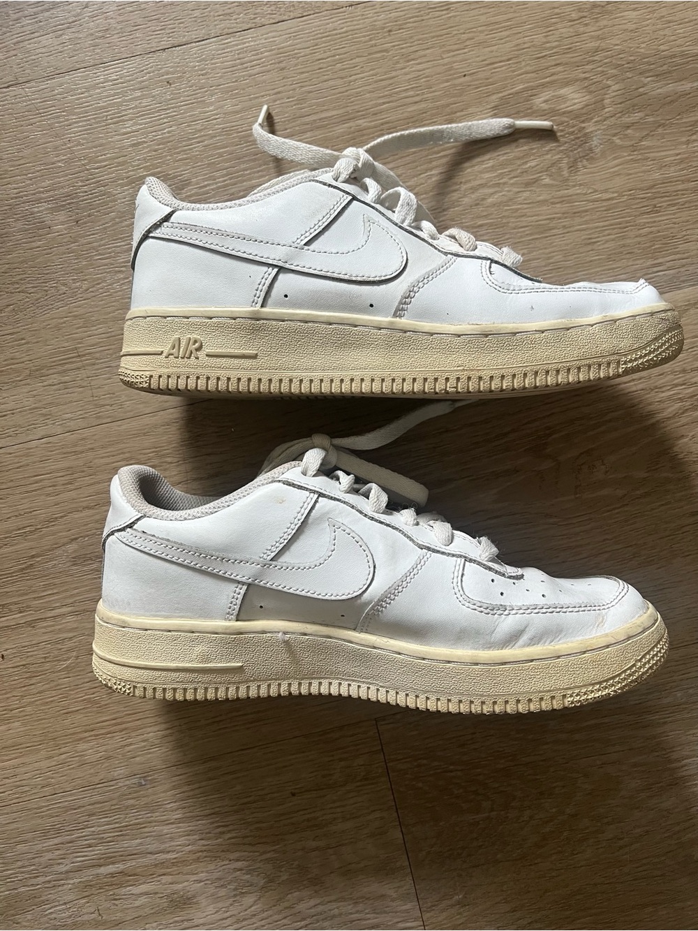 Nike Air Force 1 White Sneakers with Cream Sole Accents